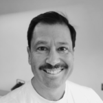 black and white photo of man with a moustache