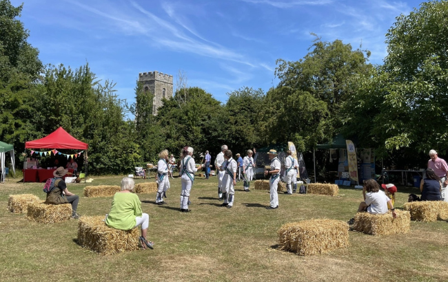 Image of people at the buzzing bee fete, dancing in a park